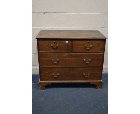 A DISTRESSED GEORGIAN OAK AND MAHOGANY CHEST OF TWO OVER TWO LONG DRAWERS, with swan neck handles on bracket feet, width 95cm