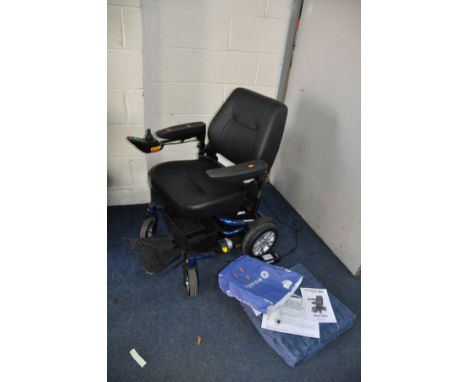 A ROMA MOBILITY RENO ELITE ELECTRIC WHEELCHAIR with charger, manual and seat pad in like new condition (PAT pass and working 