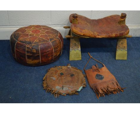 A CAMEL STOOL with a leather saddle, a patchwork leather pouffe, a leather cushion and bag (4)
