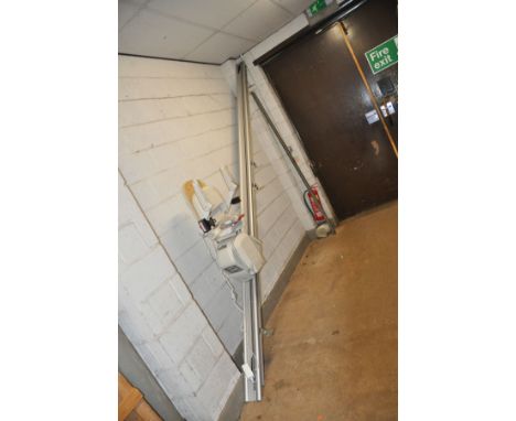 AN ACORN STAIRLIFT dated 30-1-2020 420cm long with four mounting brackets, two remote controls and manual along with a power 