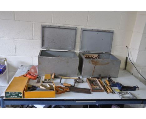 TWO METAL LIDDED BOXES containing carpenters tools including a boxed Stanley No4 plane, a boxed Stanley No 75 plane, a Foden 