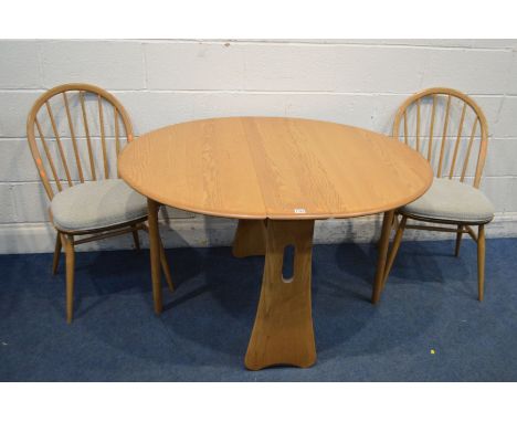 AN ERCOL BRONDE ASH GATE LEG DINING TABLE, open length 122cm x closed length 22cm x depth 107cm x height 74cm and two hoop ba