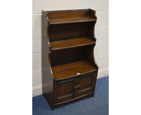 A DARK ERCOL ELM WATERFALL OPEN BOOKCASE, width 61cm x depth 33cm x height 111cm