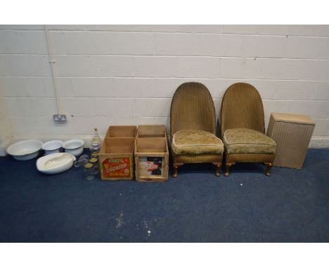A PAIR OF LLOYD LOOM WICKER CHAIRS, and a linen basket, along with two wooden fruit crates, various enamel bowls, ceramic bed