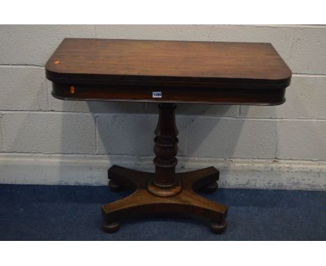 A VICTORIAN MAHOGANY CARD TABLE, the fold over top enclosing a green baize lining, on a single turned support and a triform b