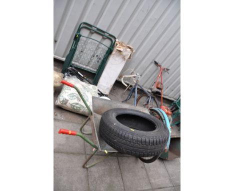 A VIRTUALLY NEW CONTINENTAL Conti Eco Contact EP 195/65 R15 91T tyre, a wheel barrow, a folding garden chair, a Vintage distr