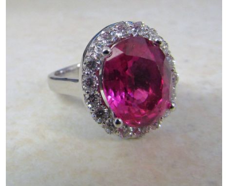 18ct white gold ring set with a single 8.8ct ruby (13 x 10 x 6 mm) and approximately 1.5ct diamonds size M (ruby with certifi