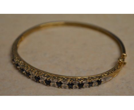 9ct gold sapphire and diamond bangle, set with approx 0.11ct of diamonds, total approx weight 11.63g 