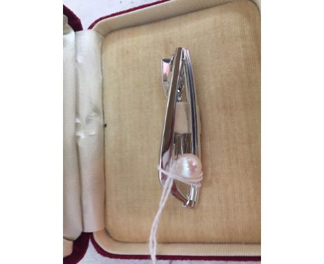 A Mikimoto cultured pearl and silver tie pin