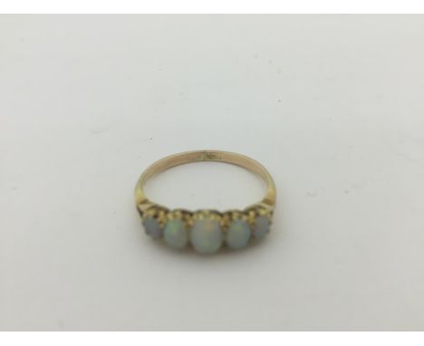 A 9ct gold and opal ring