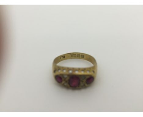 An 18ct diamond and ruby dress ring