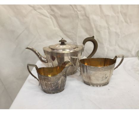 A HM silver three-piece tea service: London, 1931