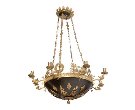 AN EMPIRE REVIVAL GILT METAL AND EBONISED-LIGHT CHANDELIER CIRCA 1860 The eight scrolling arms supported on central open dish