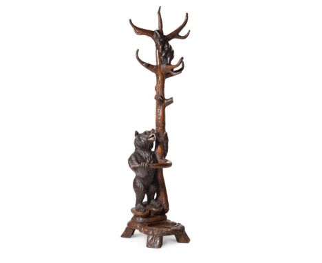 A SWISS 'BLACK FOREST' BEAR HALL STAND19TH OR EARLY 20TH CENTURYDepicting the mother bear wrapped around the base of the tree