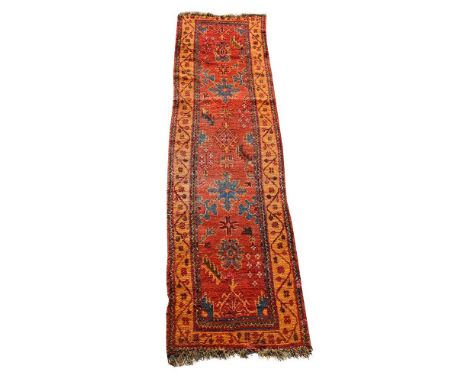 AN USHAK RUNNERapproximately 340 x 95cmCondition Report: Wear to runner overall. Various areas of additional wear, short pile
