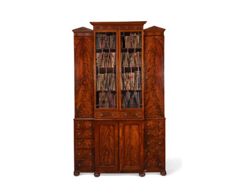 A FIGURED MAHOGANY LIBRARY BOOKCASECIRCA 1815 AND LATER The cupboards opening to shelved interiors, the lower section incorpo