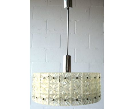 A large 1970's retro vintage translucent ceiling light fixture of round form having a band of faceted panels to the side and 