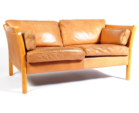 Stouby - A 1970's Danish retro vintage two seat sofa settee having a beech wood frame with shaped sides, cushioned backrests 