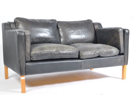 After Borge Mogensen - A 1970's Danish retro vintage two seater sofa settee having a beech frame with black leather upholster