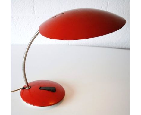 A 1950's believed Russian Soviet table / desk lamp comprising of a red painted metal saucer shade supported by a sweeping arm