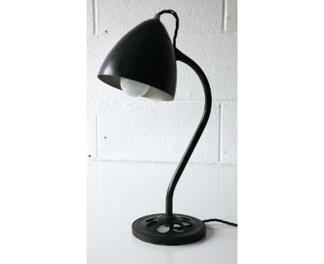 A rare 1940's vintage industrial factory work table desk lamp having an adjustable black shade on sweeping ebonised tubular a