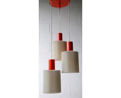 A 1960's designer retro vintage triple drop pendant ceiling light fixture comprising of a round metal ceiling rose suspending
