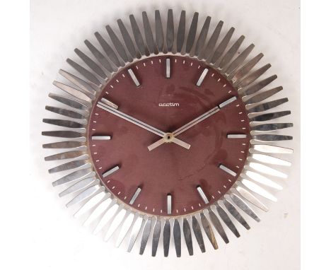 Acctim - Klienzle - A late 20th century retro vintage starburst type wall clock having a a stainless steel body, anodised alu
