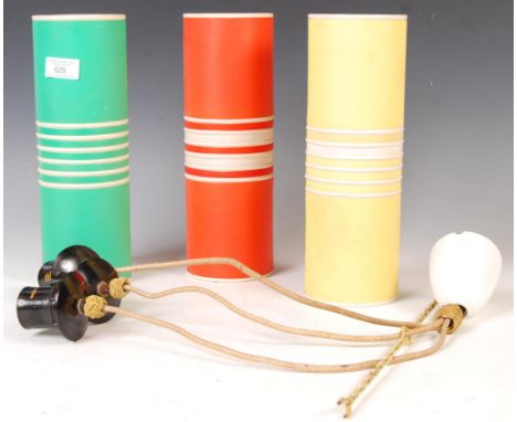 An original 1960's retro vintage ceiling light lamp fixture having three plastic cylindrical shades in orange, yellow and gre