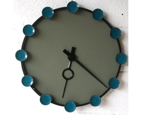 A large 1970's French retro vintage round metal wall clock comprising of a stone grey coated face with ebonised outer ring ha