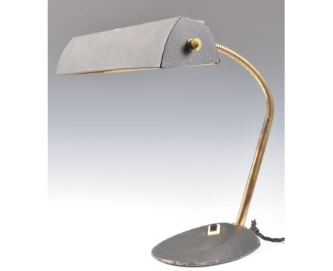 An original early to mid 20th century retro vintage bankers desk lamp light raised on a cast metal base with brass gooseneck 