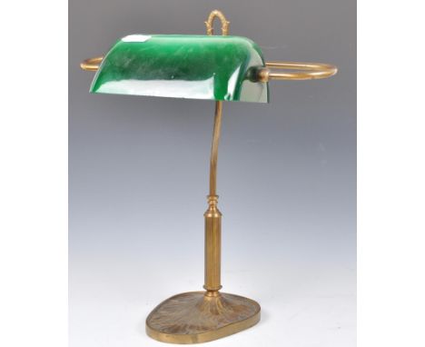 An original 1940's vintage industrial Art Deco brass bankers lamp having an adjustable green glass shade of domed lozenge sha