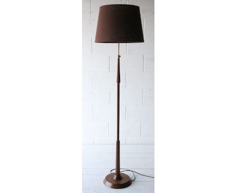 A 1960's Danish retro vintage teak wood turned floor standing / standard lamp having a round base and shaped column with bras