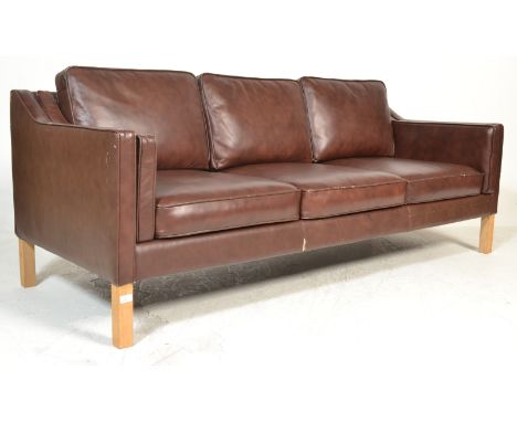 After Borge Mogensen - A late 20th century Danish retro vintage three seater sofa settee having a beech frame with chocolate 