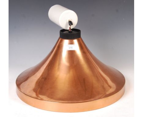 An original 1970's retro vintage ceiling light lamp fixture having a trumpet shaped copper pendant shade with rise and fall a