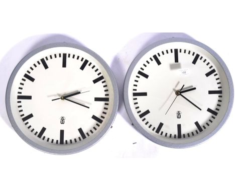 Geratewerk - Leipzig - A pair of original 1960's retro vintage industrial factory / station clock having white enamel face wi