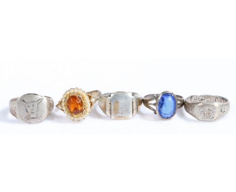 Five rings, four silver and white metal together with a dress ring&nbsp;