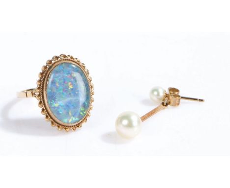 9 carat gold ring the oval head set with a blue stone, ring size P weight, together with a single 9 carat gold and pearl earr