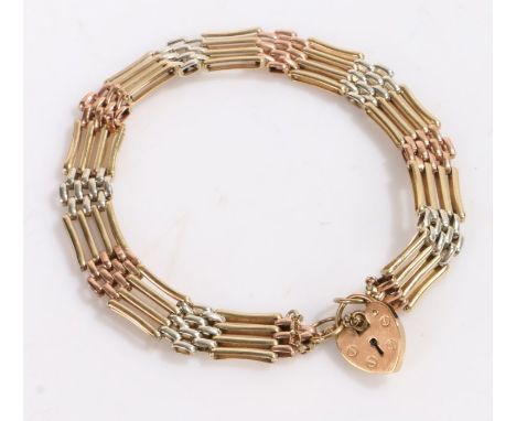 9 carat gold tri metal gate link bracelet with a heart locket, weight 9.5 grams&nbsp;