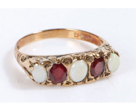 9 carat gold ring, the head set with opals and garnets, ring size O weight 3.0 grams&nbsp;