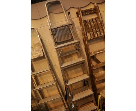 Two pairs of aluminium step ladders. Not available for in-house P&amp;P. 