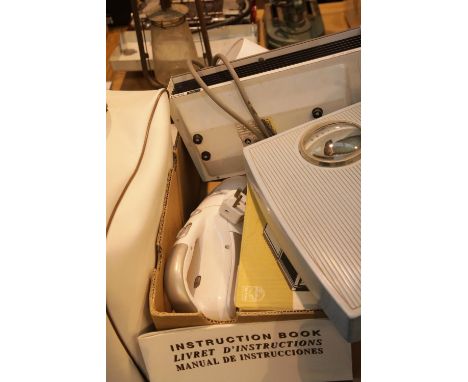 Janome New Home sewing machine and a box of household electricals. Not available for in-house P&PCondition Report: All electr