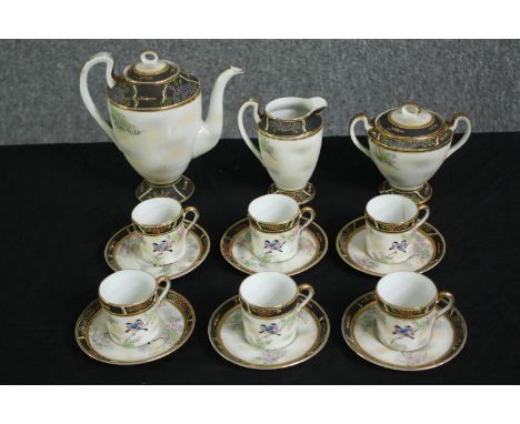 A Japanese tea service, with painted bird decoration. H.18cm. (largest).