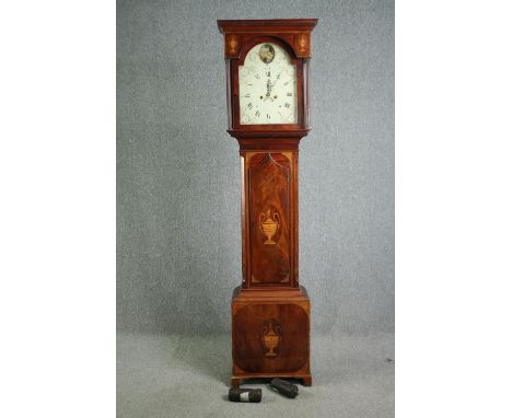 A late 18th century mahogany eight day longcase clock, with Sheraton style urn and fan inlay, the enamelled dial painted with