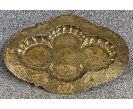 A vintage Indian charger with all over engraved decoration. H.52 W.75cm 