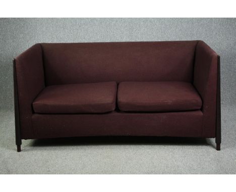 A contemporary tub form sofa with ebonised frame. H.87 W.175 D.92cm. 