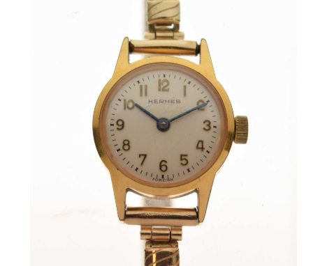 Hermes - Lady's gold plated cocktail watch, having a silvered dial with gilt Arabic numerals and blued steel hands, manual wi