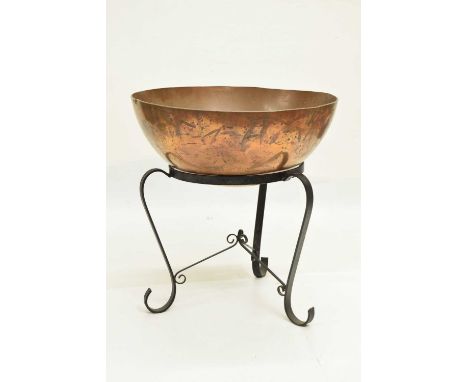 Copper planter, of hemispherical form mounted on wrought iron stand with scroll supports, 59cm x 62cm high overall