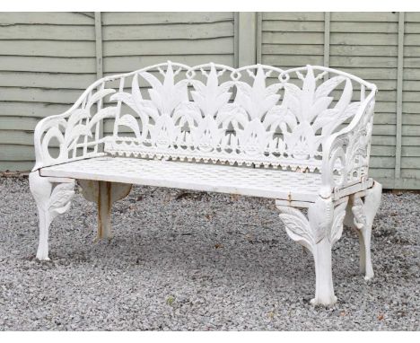 2Oth Century Coalbrookdale-style white painted cast iron garden bench, the shaped back and sides cast with Lily of the Valley