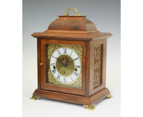 Reproduction walnut cased chiming bracket clock by Franz Hermle, brass dial with white Roman chapter ring, foliate spandrels 