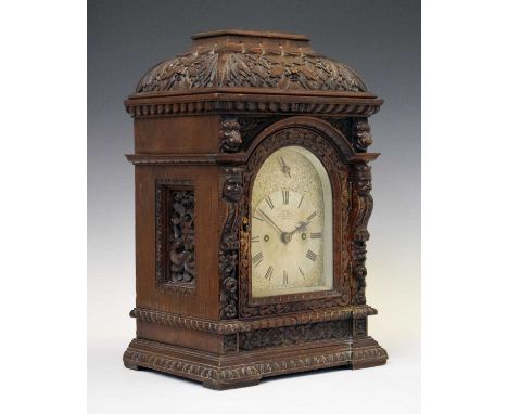 Victorian carved oak twin fusee bracket clock 'Dent, to the Queen, 33 Cockspur St., London', the signed silvered arched Roman